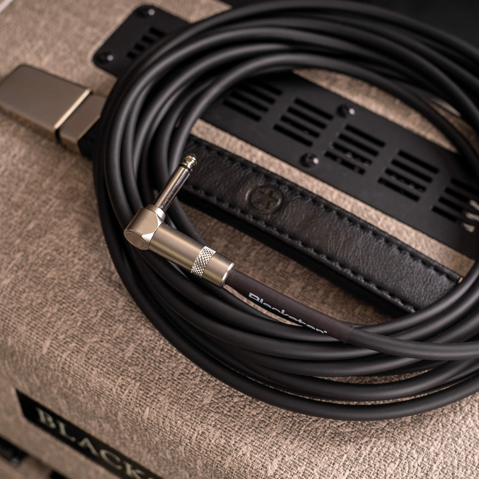 Blackstar instrument cable on top of amplifier