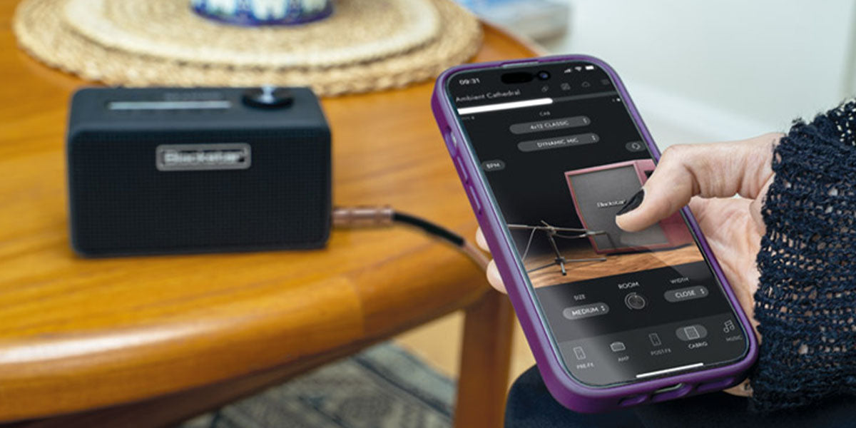 Person using a phone software app and BEAM Mini on a table