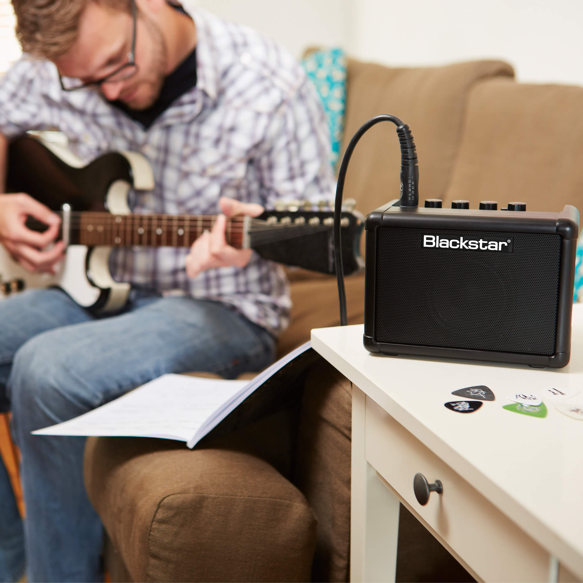 guitar player practicing with a Blackstar Amps FLY 3 mini guitar amplifier