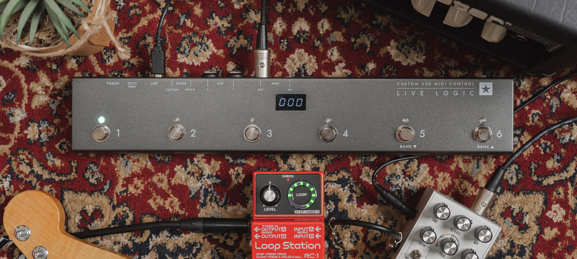 Blackstar Live Logic USB MIDI Controller on rug by amp, guitar, and pedals