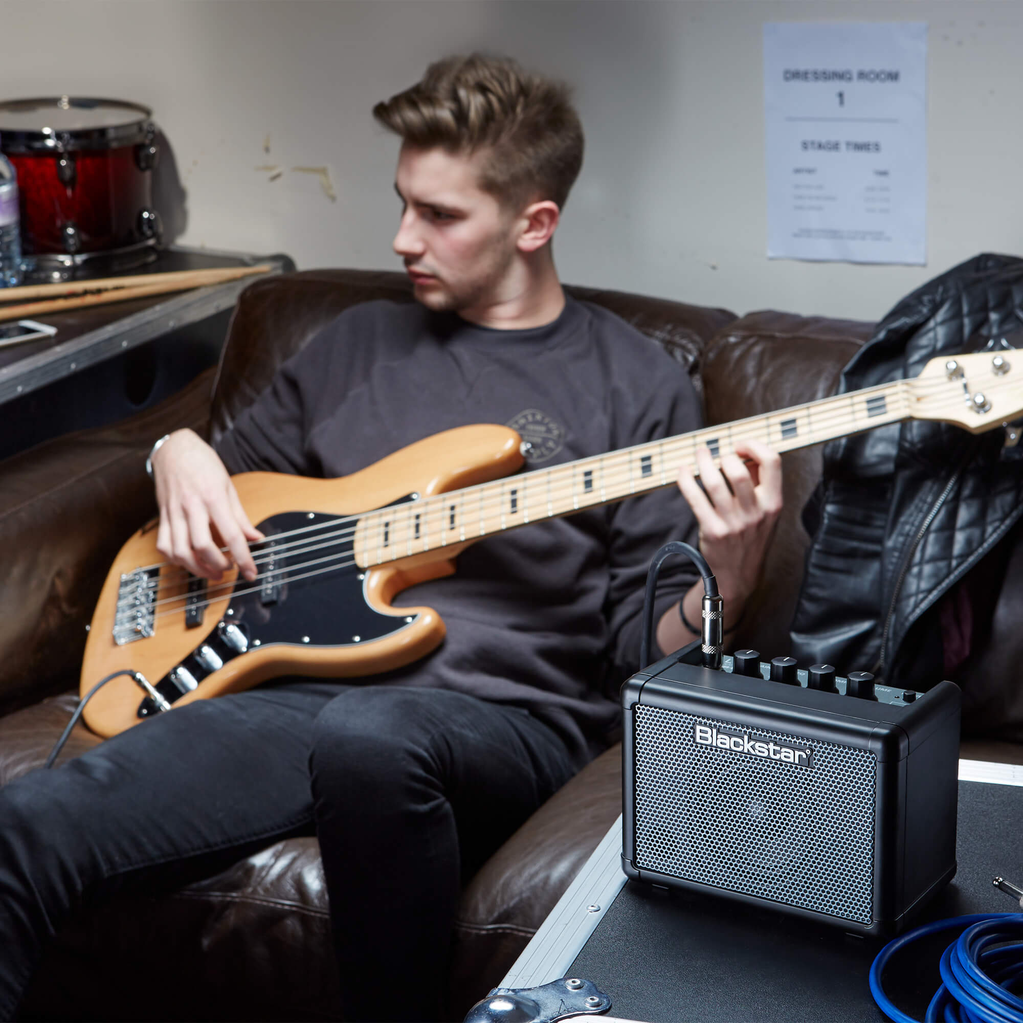 bass player plugged into Blackstar Amps FLY 3 bass mini amplifier
