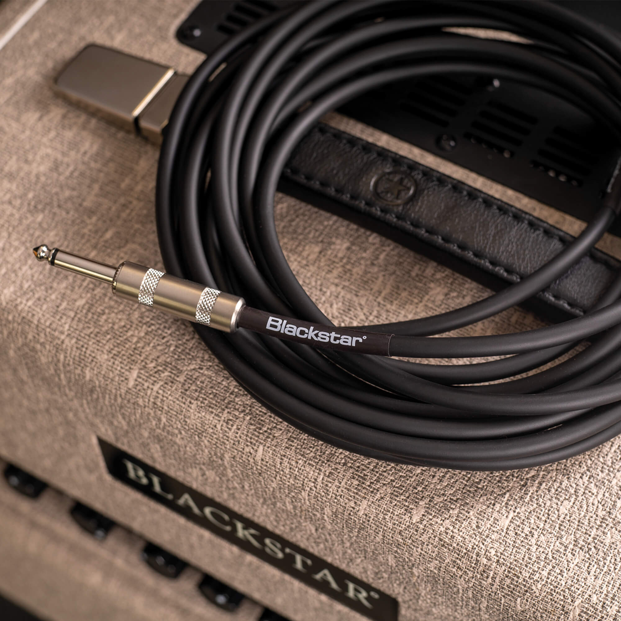 Blackstar instrument cable on top of amplifier