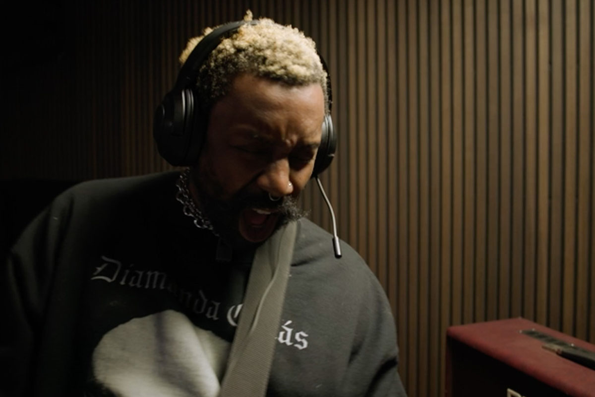 Man wearing headphones in a recording studio setting


